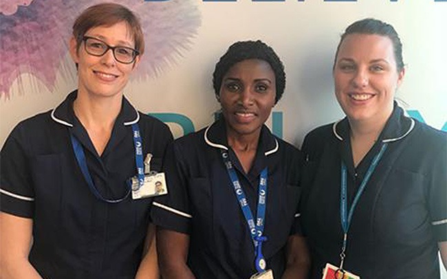 Three smiling midwives