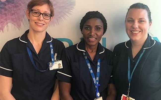 Three smiling midwives